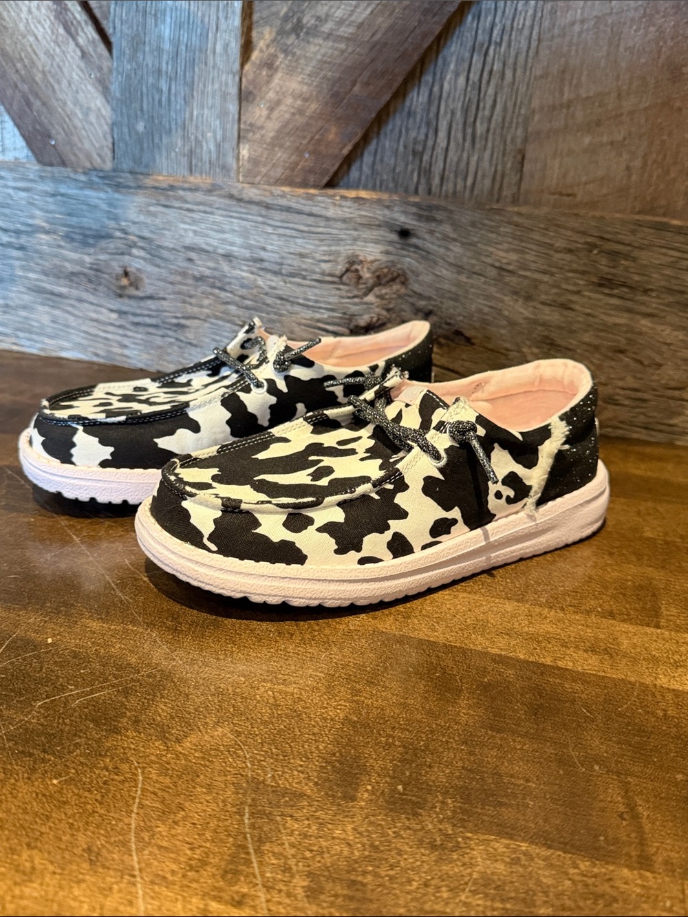 Girls Hey Dude Black & White Cow Print slip on
